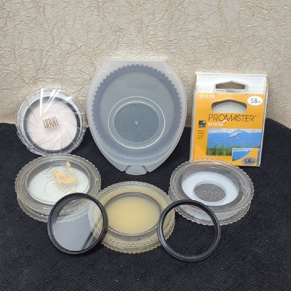 collection of camera lens filters, likely used‎ for photography